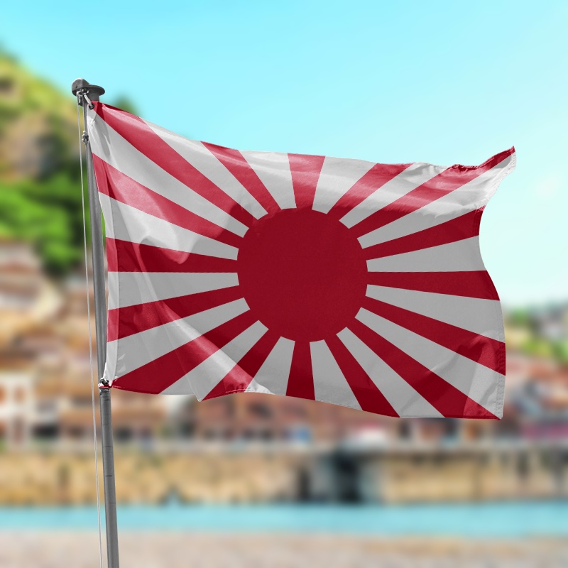 bandera ejercito imperial japones blanca con rajas rojas y un circulo rojo en el centro ondeando en una playa